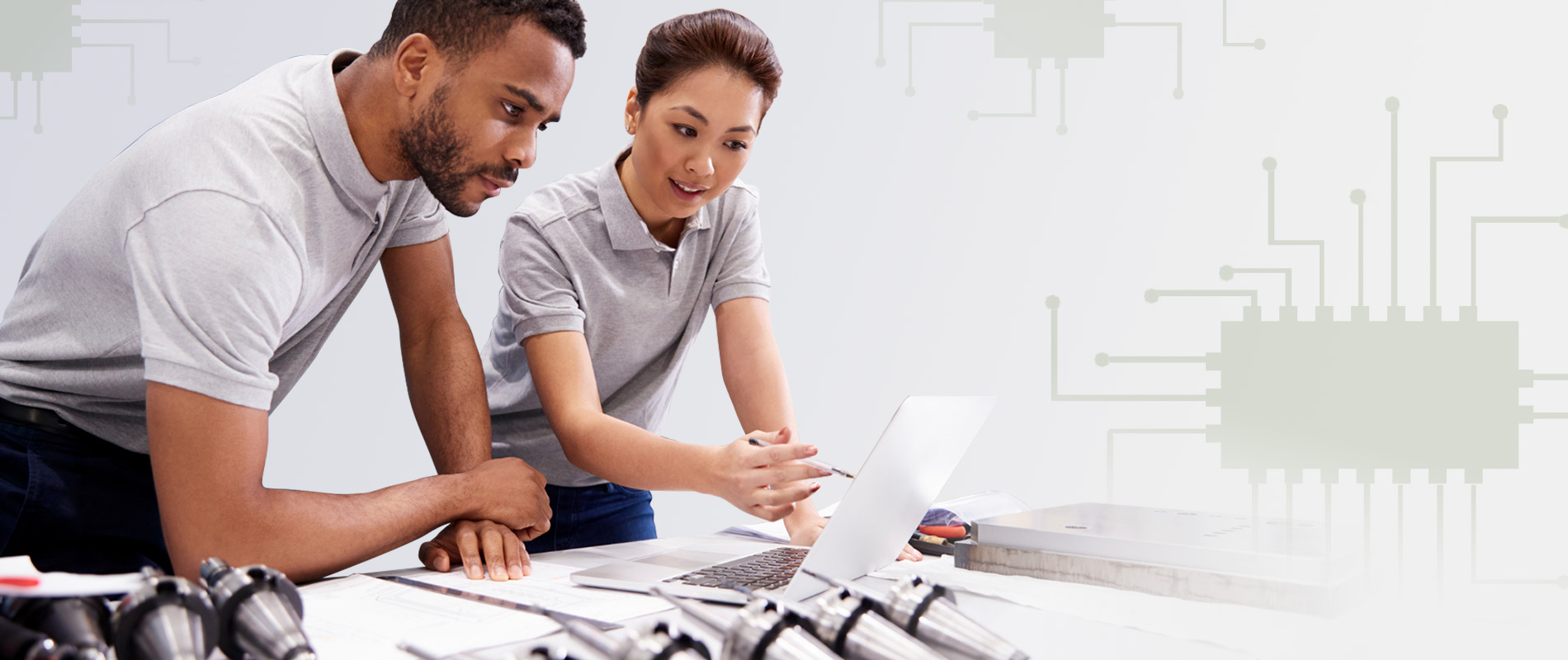 Engineers looking at computer